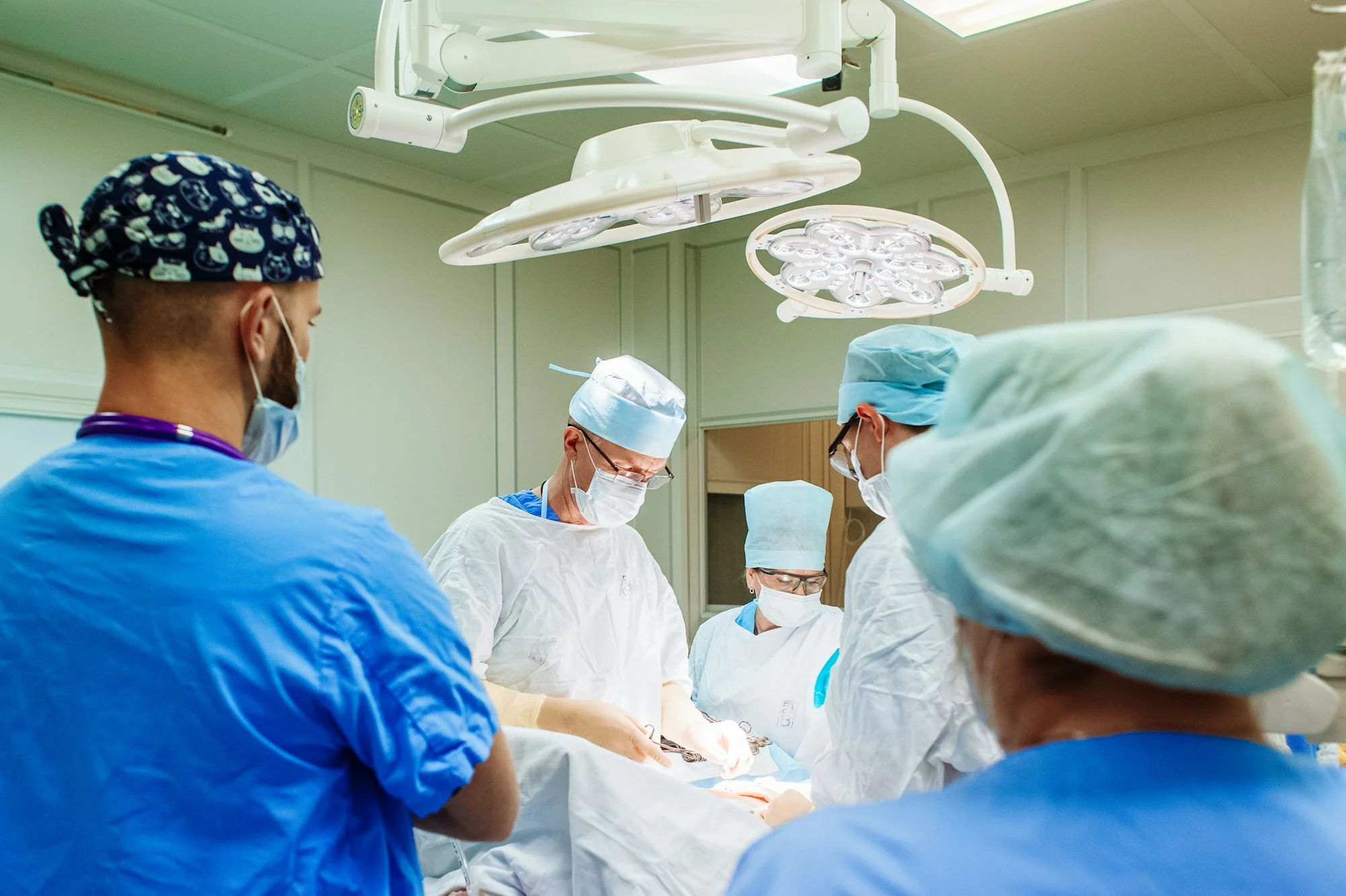 Medical Team Performing Surgical Operation in Modern Operating Room.