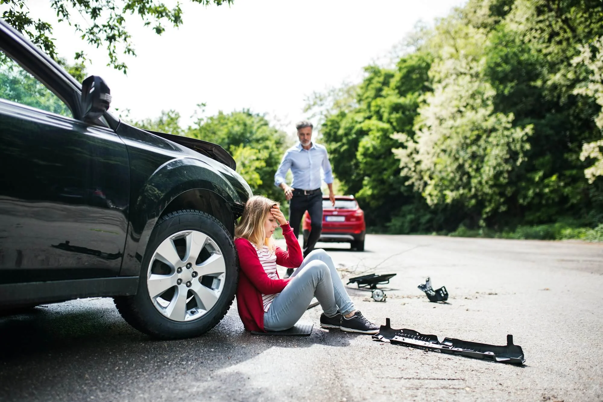 young-woman-by-the-car-after-an-accident-and-a-man-running-towards-her-1